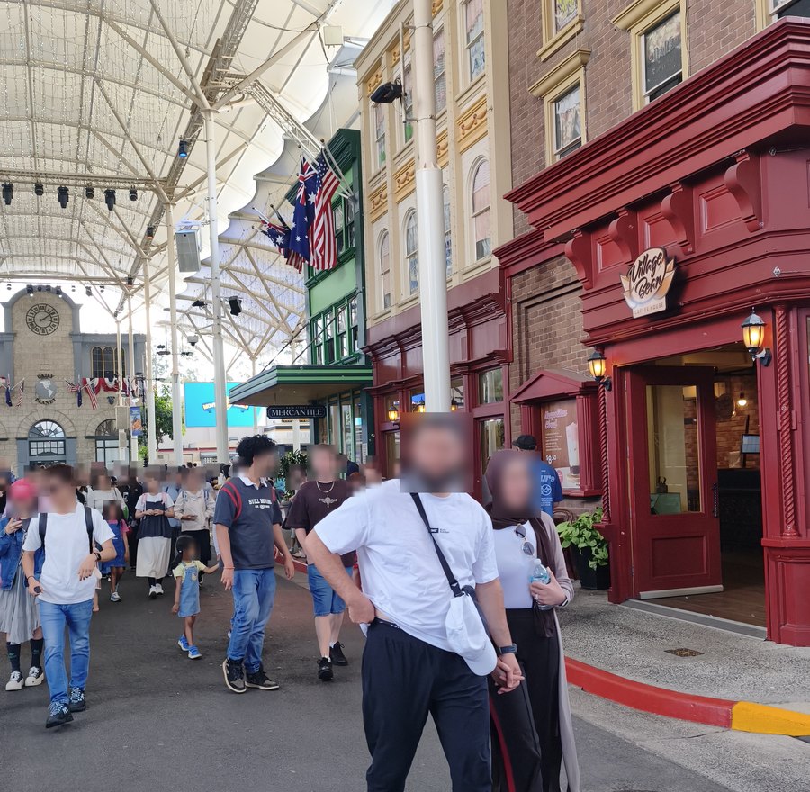 Visitors walking along the red-brick Main Street at Movie World on the Gold Coast